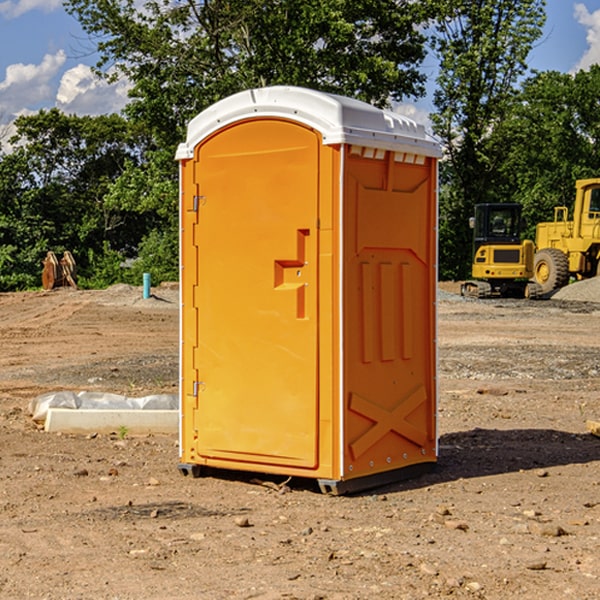 what is the cost difference between standard and deluxe portable toilet rentals in Swink